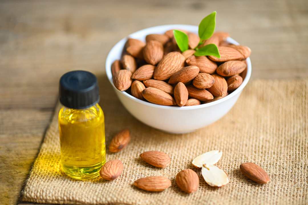 almond with oil image in blog Almonds benefits for skin